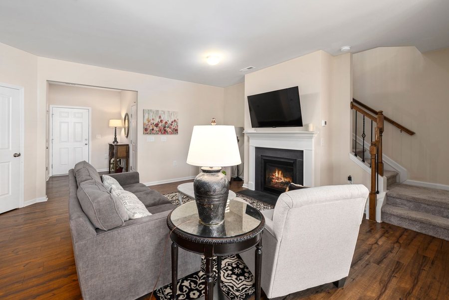 Cozy, comfortable living room with a warm fireplace