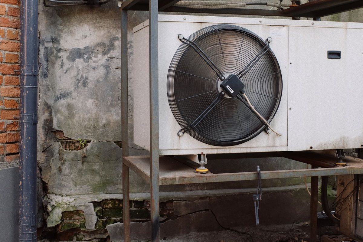 Outdoor air conditioner condenser units mounted beside a building