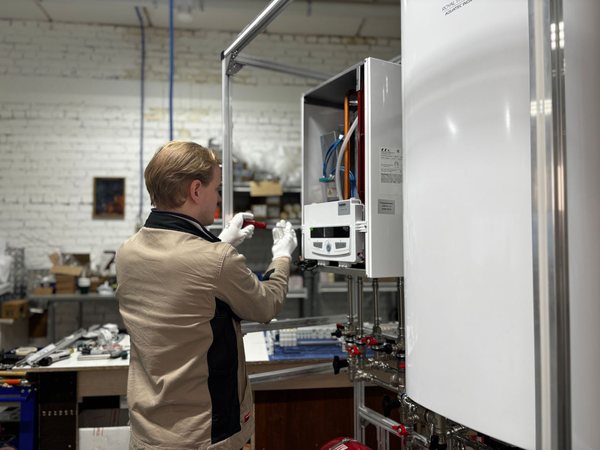 Technician servicing a furnace
